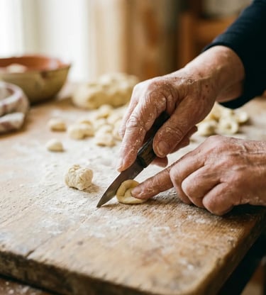Experienced hands shaping fresh orecchiette pasta with knife on rustic wooden table in Lecce