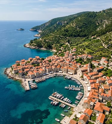 Aerial view of Komiža fishing village and harbor on Vis island Croatia