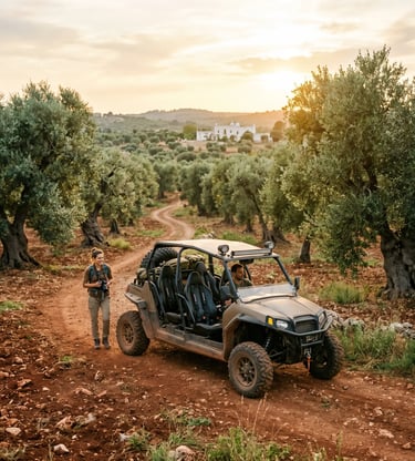 4-seater off-road buggy parked on red dirt track in Puglia olive grove at golden hour