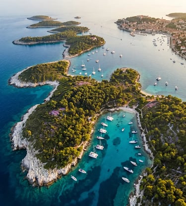 Aerial view of Hvar town and Pakleni Islands with turquoise bays and luxury yachts at sunset
