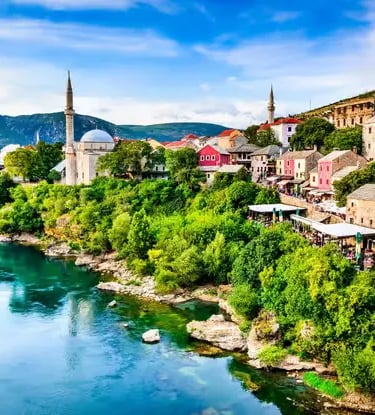 Mostar city with mosque minarets and turquoise Neretva River, Bosnia