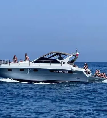 Small-group tour boat cruising the open Tyrrhenian Sea along the Amalfi Coast