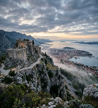 Klis Fortress perched on rocky ridge above Split with morning mist and Adriatic Sea view