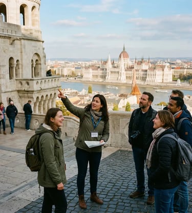 Tour guide pointing at Budapest Parliament from Fisherman's Bastion with small group
