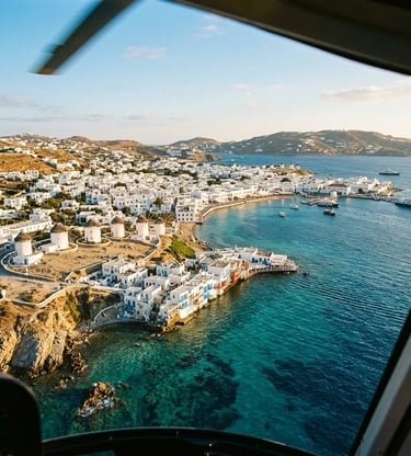 Mykonos windmills and Little Venice coastline seen from approaching helicopter