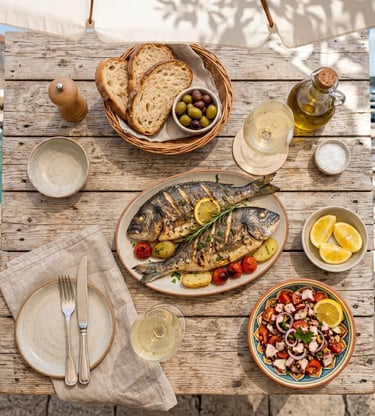 Grilled fish, octopus salad, bread and white wine on rustic table at Hvar harbor restaurant