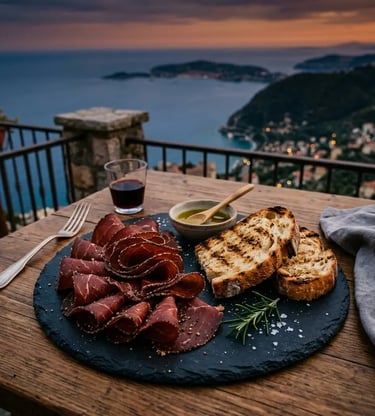 Slavonian pepper-spiced cured meat with grilled bread on slate plate overlooking Adriatic coast
