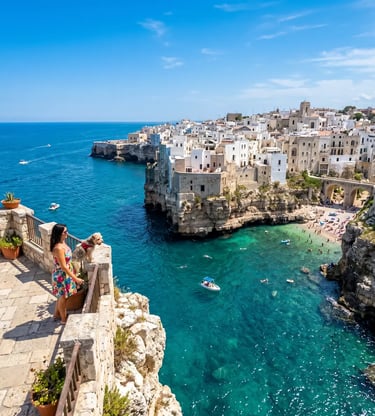Woman with small dog admiring Polignano a Mare turquoise cove and whitewashed cliffside houses