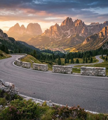 Winding mountain road with stone barriers, Dolomite peaks and Cortina valley at golden hour