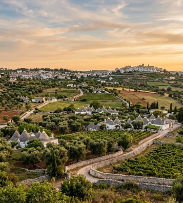 Trulli farmhouses and olive groves in Valle d'Itria Puglia at golden hour