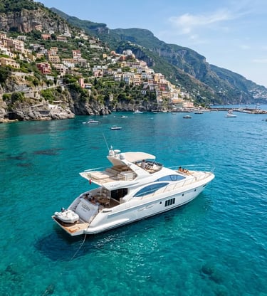 White Azimut luxury yacht anchored in turquoise water near colorful Amalfi Coast cliffs