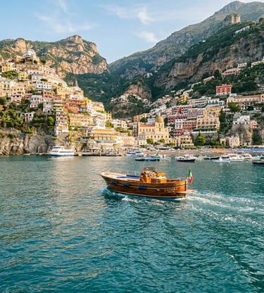 Wooden gozzo boat departing Positano harbor toward Capri, pastel cliffside town in morning light