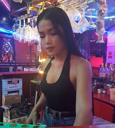 Thai woman behind the bar at Wonderland in Hua Hin