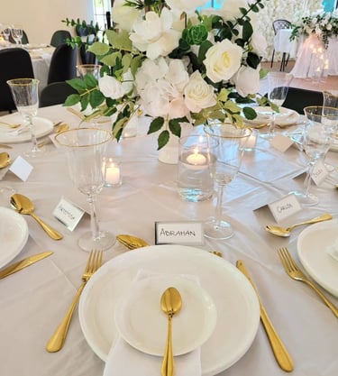 Gold Tableware with a floral centerpiece