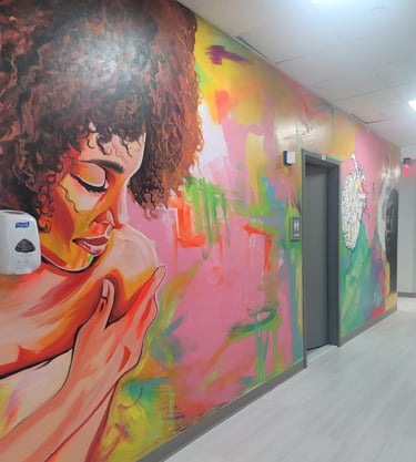 A woman looking over her shoulder painted on the previously blank wall.