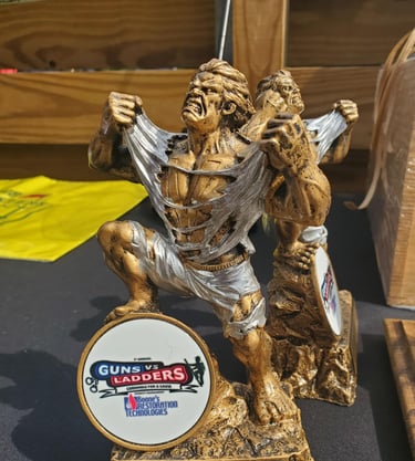 Guns vs Ladders Cornhole trophy