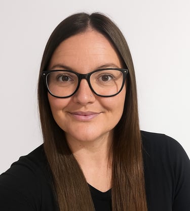 a woman with glasses and a black top