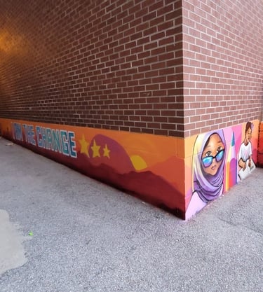 An exterior wall of a school play area after adding images of children.