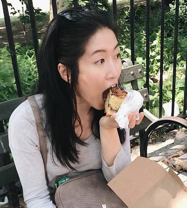 little twist bakery founder eating on a bench in NYC