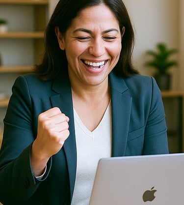 Latina businesswoman in her 40s celebrating success while looking at her laptop in a office