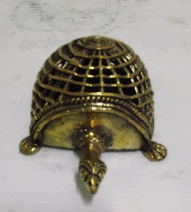 "Handcrafted brass tortoise with mesh-style carving on back–top view-for global shipment"