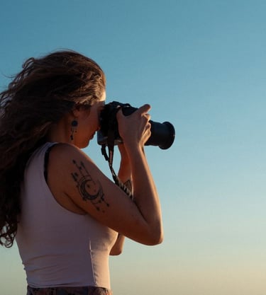 a woman taking a picture with a camera