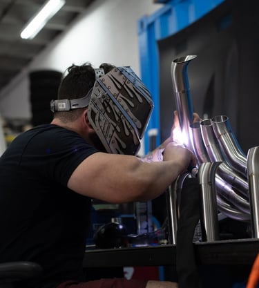 Don Abenante welding custom fabricated car headers