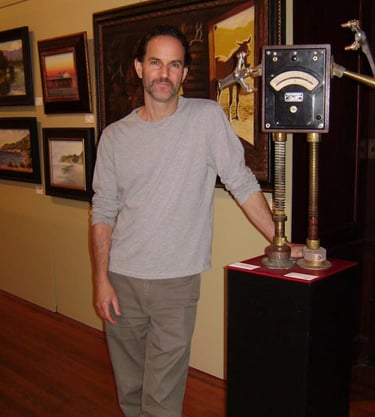 Tal Avitzur with robot sculpture in the Santa Barbara Natural History Museum 2011 group show.