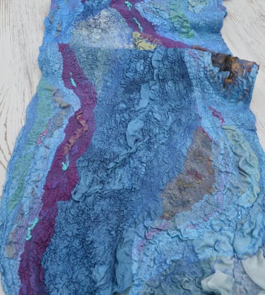 Handmade nuno felted wool scarf in blue and purple shades with textured silk ruffles.