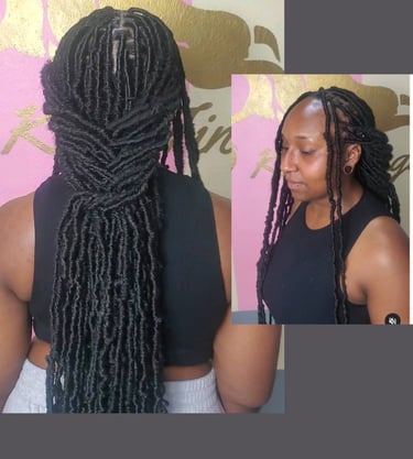A woman with long, neatly styled faux locs, flowing effortlessly down her back. The smooth, well-crafted locs create a sleek