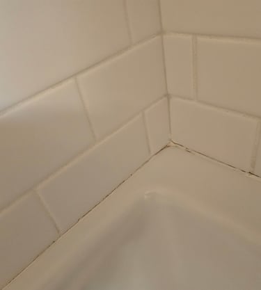 Re-caulking/Re-siliconing: Resealing around tubs