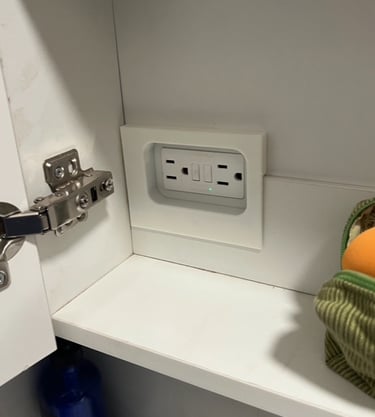 3d printed cover over electrical outlet in bathroom cupboard