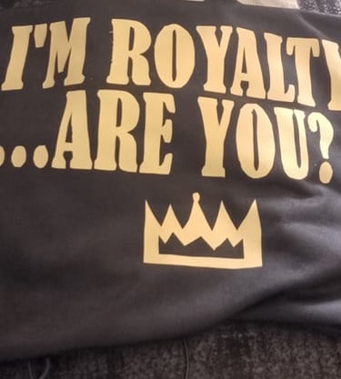 "I'm Royalty are you?" text. Gold on black
