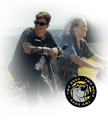 a man and woman riding on a scooter