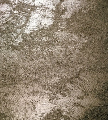 A warm silver paint sample showing its lustre and beautiful grainy texture.