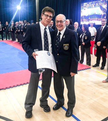 Shihan Michael Monaco receives 8th Dan from Hanshi Steve Arneil at 2019 BKK Open