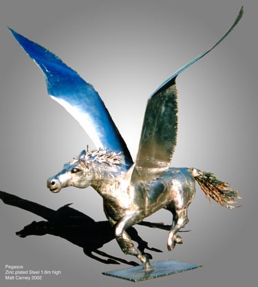 a statue of a silver pegasus