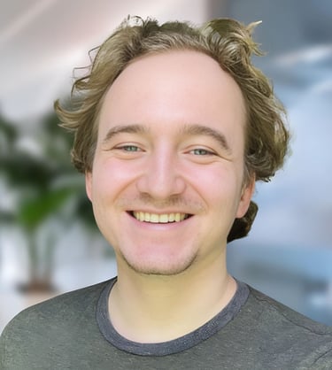 a man with a beard and a beard smiling
