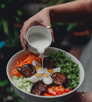 a person holding a sandwich with a sandwich on it