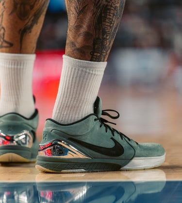 a man with tattoos on his legs and a tattoo on his leg