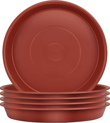 a stack of three red plates with a bowl of food