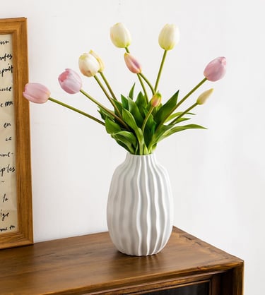 a vase with flowers in a vase on a table