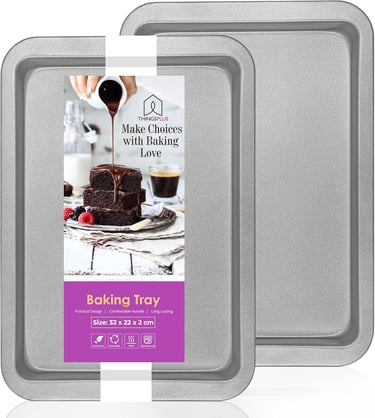 a baking tray with a cake and a cupcake