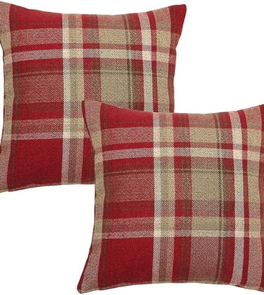 a pair of pillows with a red and beige plaid pattern