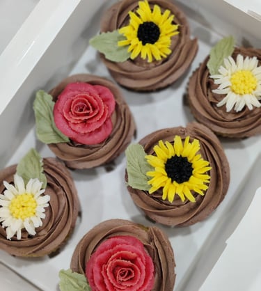Cupcakes with roses, daisies, and sunflowers