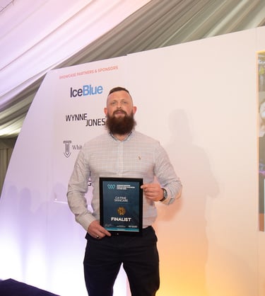 luke sargent the owner of cafine skincare holding an worcestershire innovation award