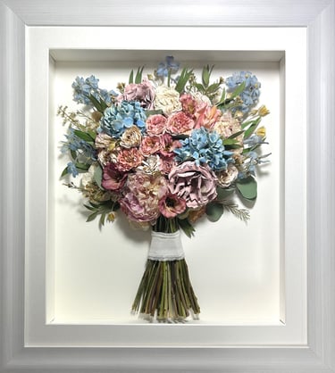 a side view preserved wedding bouquet of soft pinks and blues