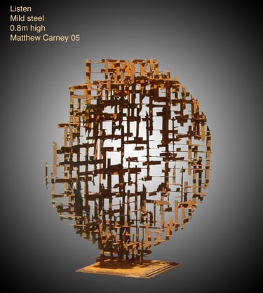 a rusted steel cross-hatched circle sculpture  