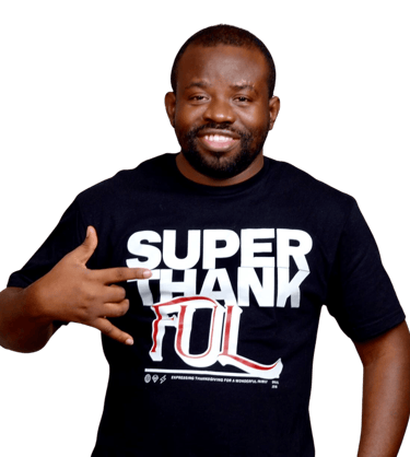 a man with a super thankful black t - shirt - Image of the founder of Radiant Side:  Dr. Olaomo