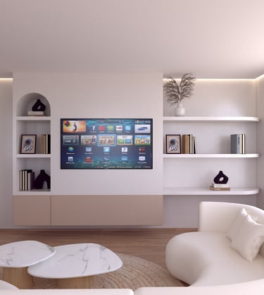 Modern living room with a smart TV mounted on a minimalist white wall with built-in shelves and a curved sofa.